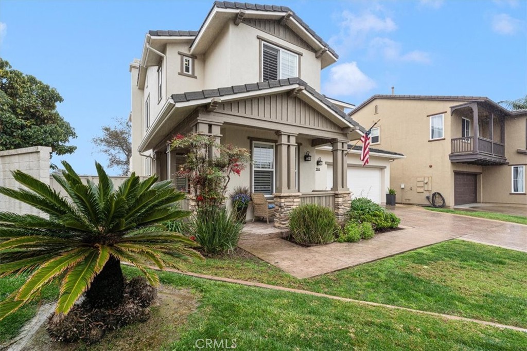 704 Corte Buscando San Clemente, CA 92673 - Photo 2 of 43 a front view of a house with a garden and plants