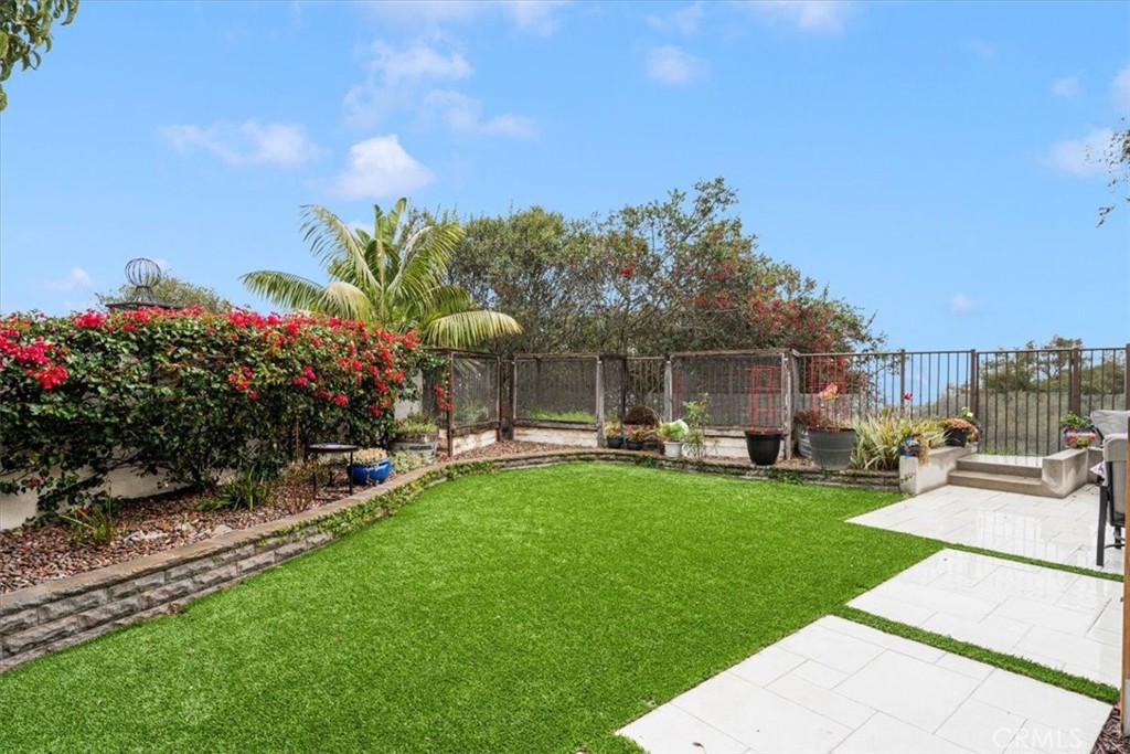 704 Corte Buscando San Clemente, CA 92673 - Photo 30 of 43 a view of a house with backyard sitting area and garden