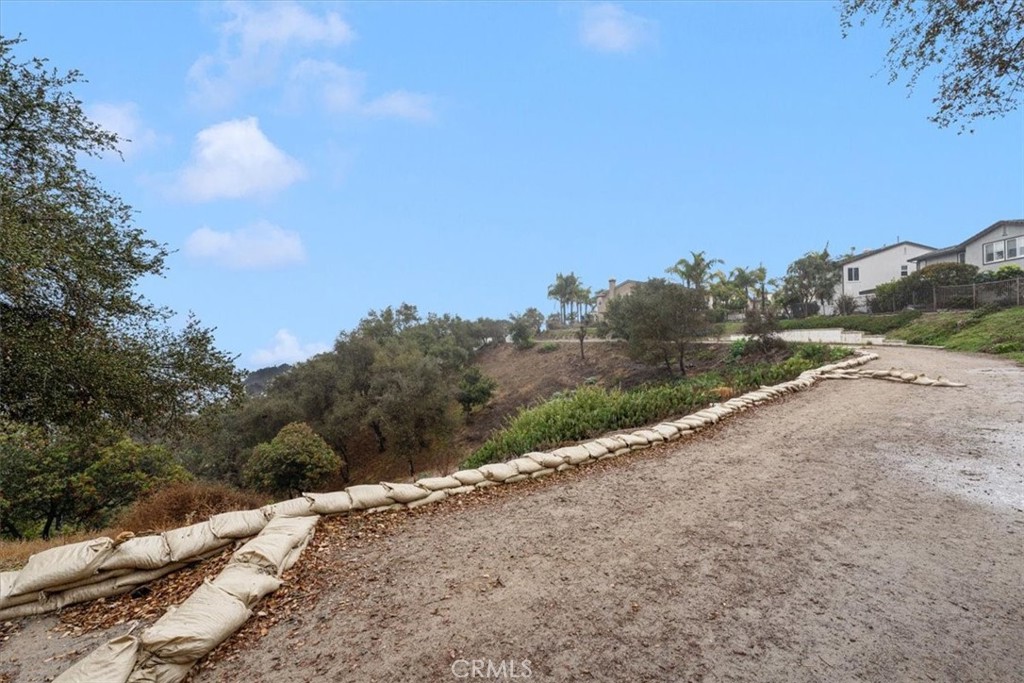 704 Corte Buscando San Clemente, CA 92673 - Photo 35 of 43 a view of a road with a building in the background