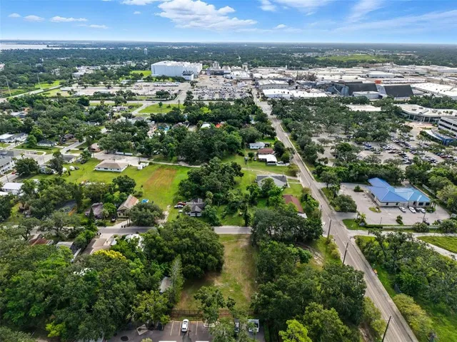 an aerial view of residential building and lake
