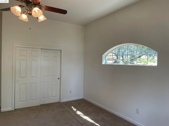 a view of a brick house with a large window