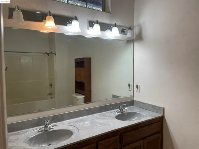 a bathroom with a shower and a bath tub