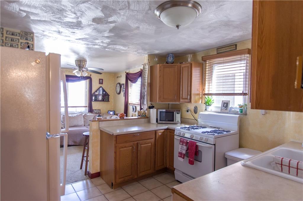931 Liberty Street McKees Rocks, PA 15136 - Photo 11 of 41 a kitchen with a sink stove and refrigerator