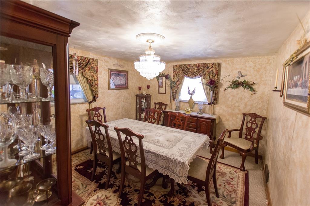 931 Liberty Street McKees Rocks, PA 15136 - Photo 12 of 41 a view of a dining room with furniture and chandelier