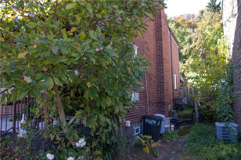 931 Liberty Street McKees Rocks, PA 15136 - Photo 41 of 41 a view of a backyard with plants and large trees
