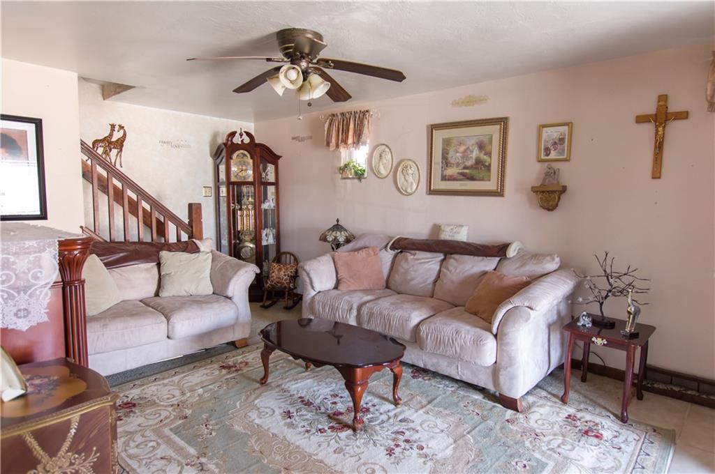 931 Liberty Street McKees Rocks, PA 15136 - Photo 5 of 41 a living room with furniture and a chandelier