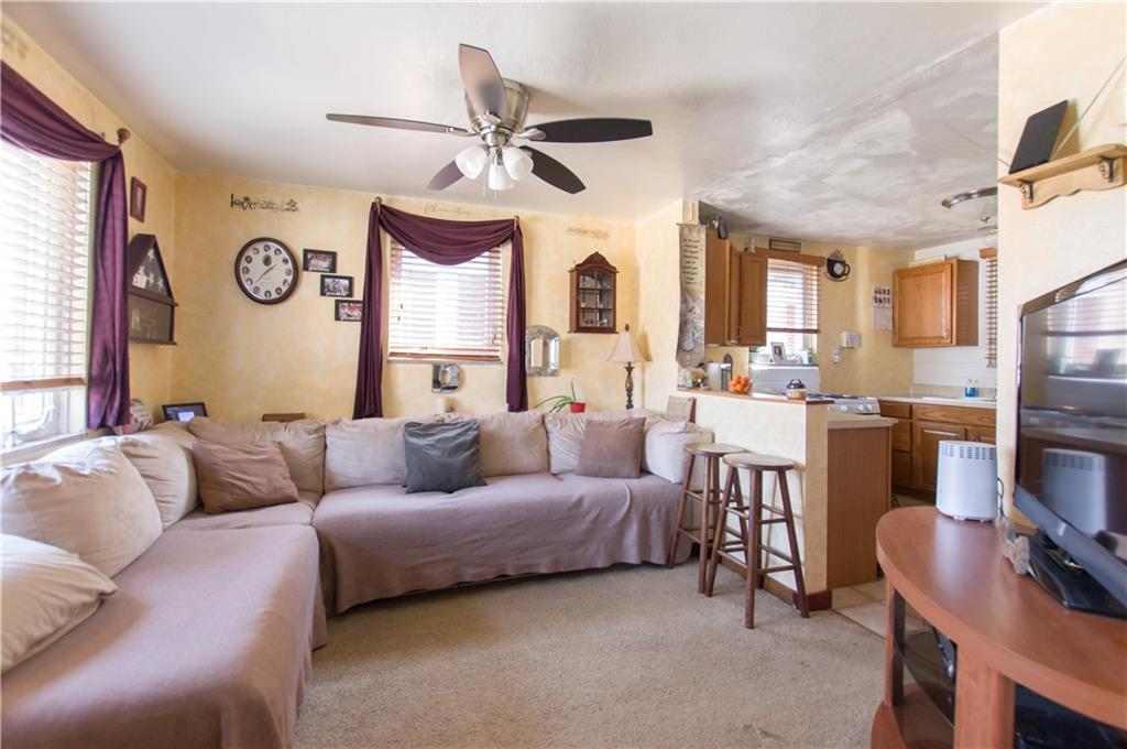 931 Liberty Street McKees Rocks, PA 15136 - Photo 6 of 41 a living room with furniture kitchen view and a window