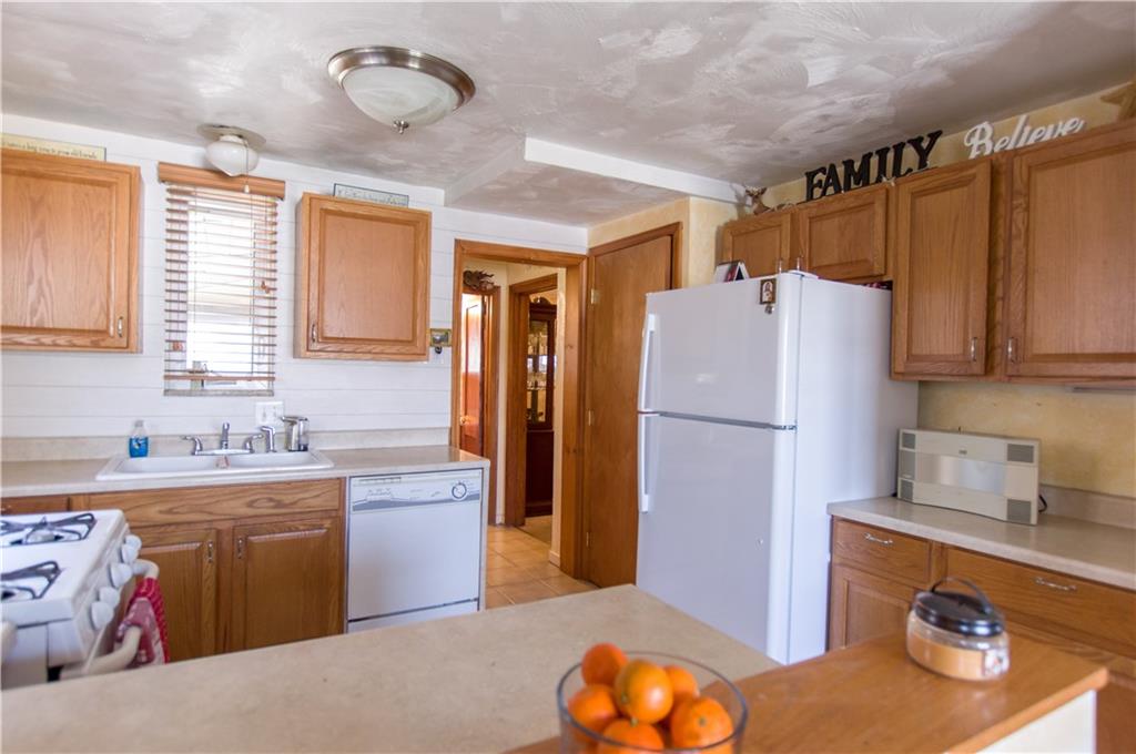 931 Liberty Street McKees Rocks, PA 15136 - Photo 10 of 41 a kitchen with a refrigerator and a sink