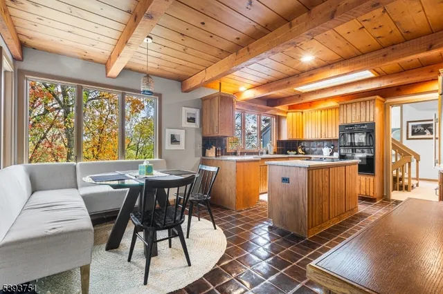 a dining room with granite countertop a sink and a table