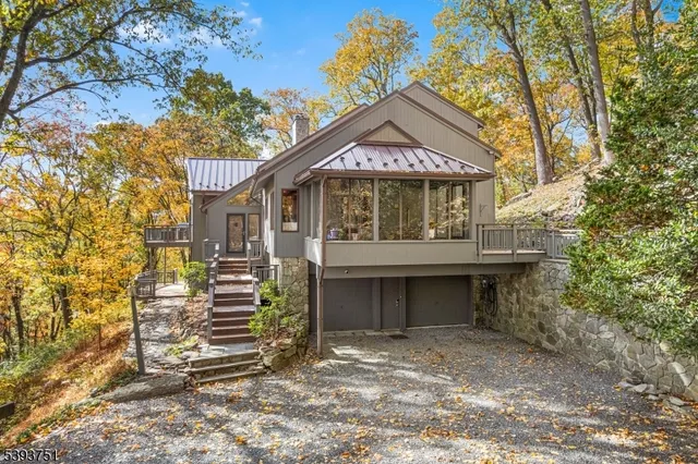 a view of a house with a yard and garage