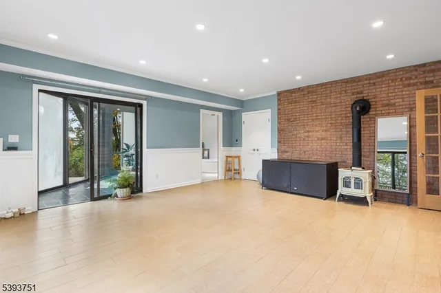 a view of an empty room with glass door