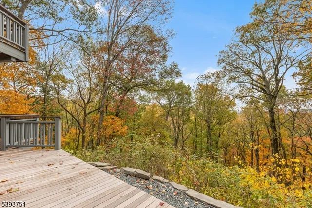 a wooden bench sitting in front of a building