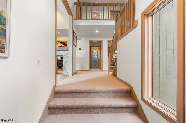 a spacious bedroom with a bed and a window