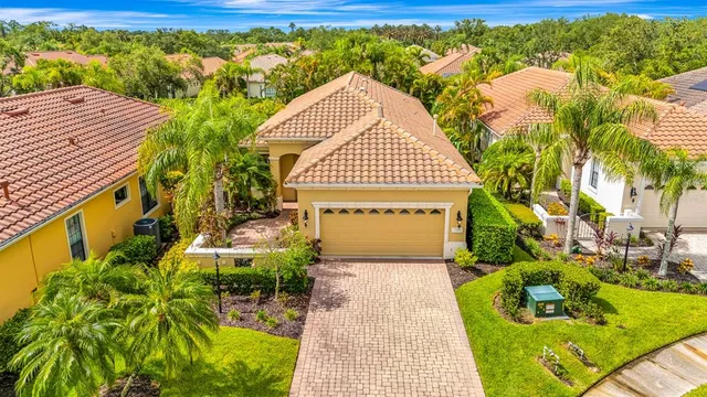 a view of backyard with swimming pool and outdoor seating