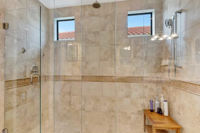 a view of a backyard with table and chairs under an umbrella