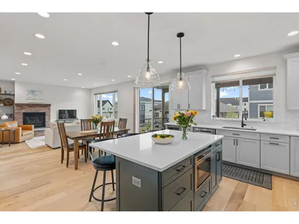 a kitchen with white cabinets and a sink