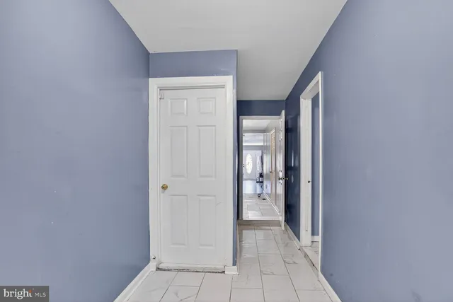 a view of a closet area with empty room