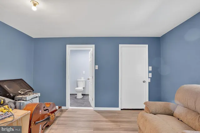 a bedroom with a bed and couch