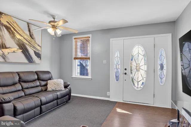 a living room with furniture with a chandelier