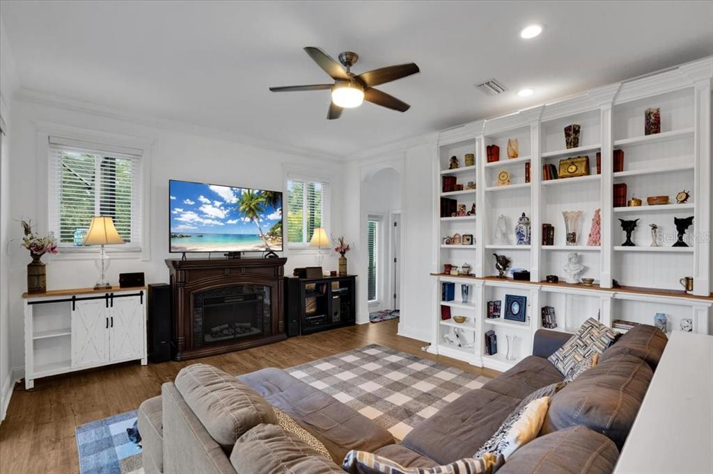 7601 226th Street East Bradenton, FL 34211 - Photo 12 of 50 a living room with furniture and a flat screen tv