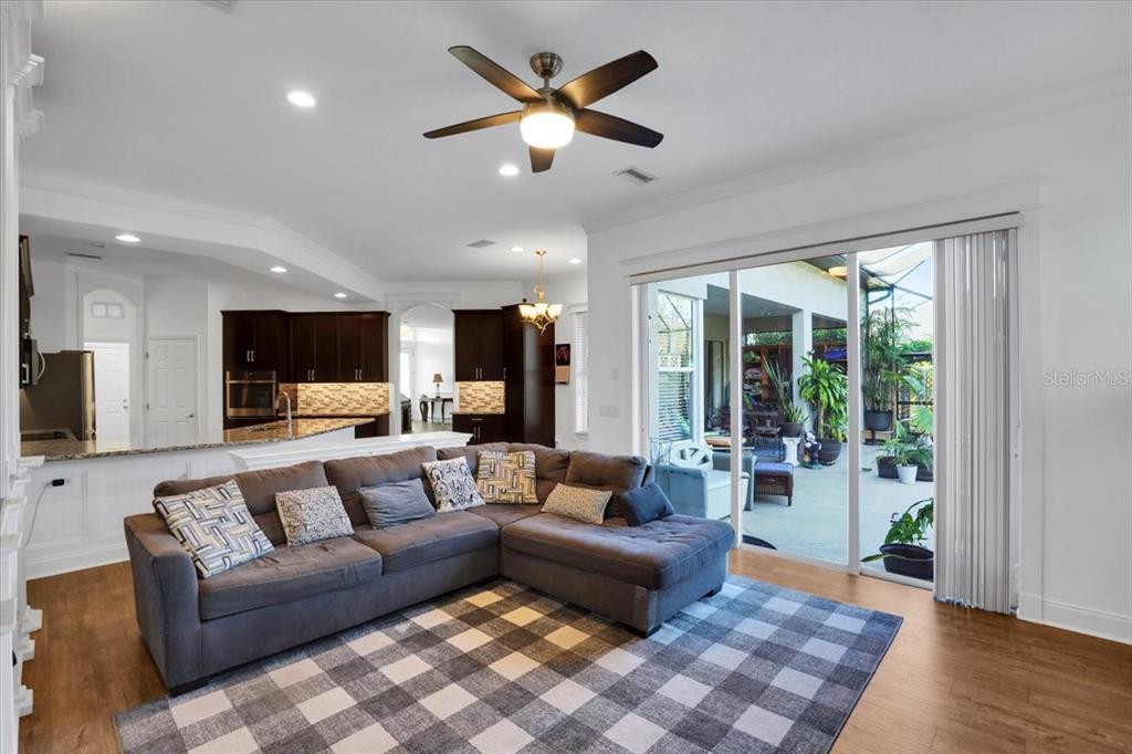 7601 226th Street East Bradenton, FL 34211 - Photo 15 of 50 a living room with furniture and a flat screen tv