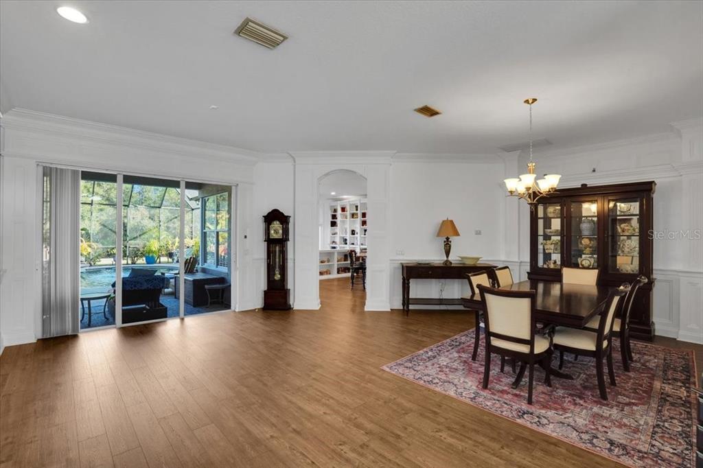 7601 226th Street East Bradenton, FL 34211 - Photo 16 of 50 a living room with furniture and a table