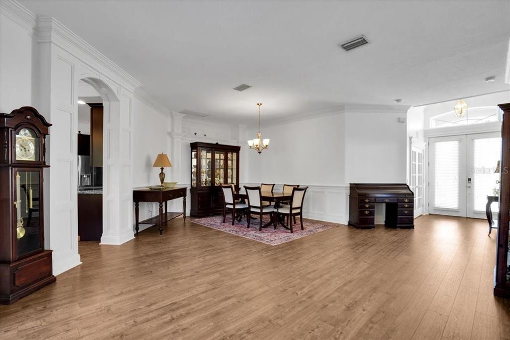 7601 226th Street East Bradenton, FL 34211 - Photo 20 of 50 a view of a livingroom with furniture and a wooden floor
