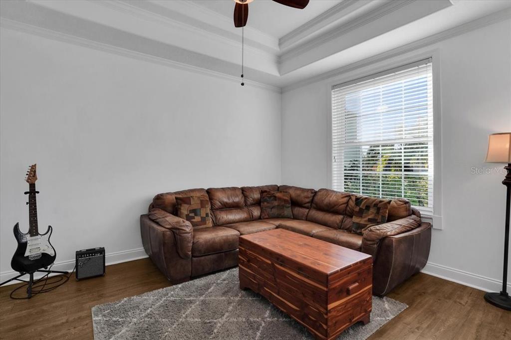 7601 226th Street East Bradenton, FL 34211 - Photo 22 of 50 a living room with furniture and a window