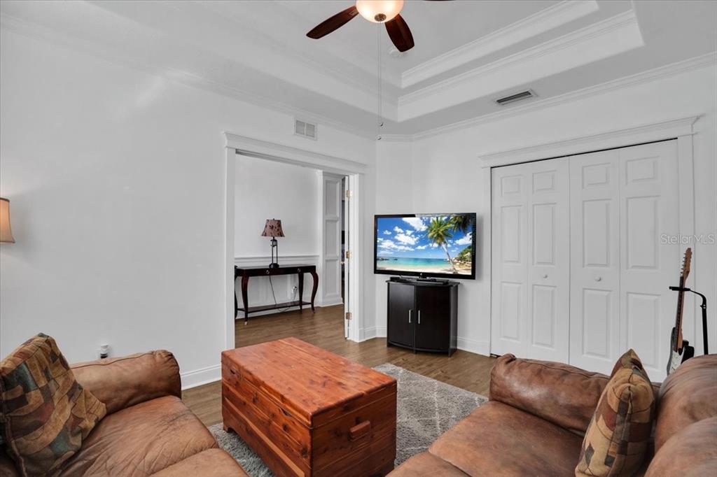 7601 226th Street East Bradenton, FL 34211 - Photo 23 of 50 a living room with furniture and a flat screen tv