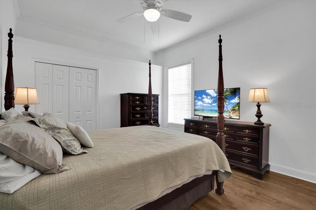 7601 226th Street East Bradenton, FL 34211 - Photo 29 of 50 a bedroom with a bed and a dresser