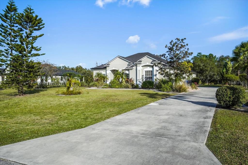 7601 226th Street East Bradenton, FL 34211 - Photo 3 of 50 a view of house with garden