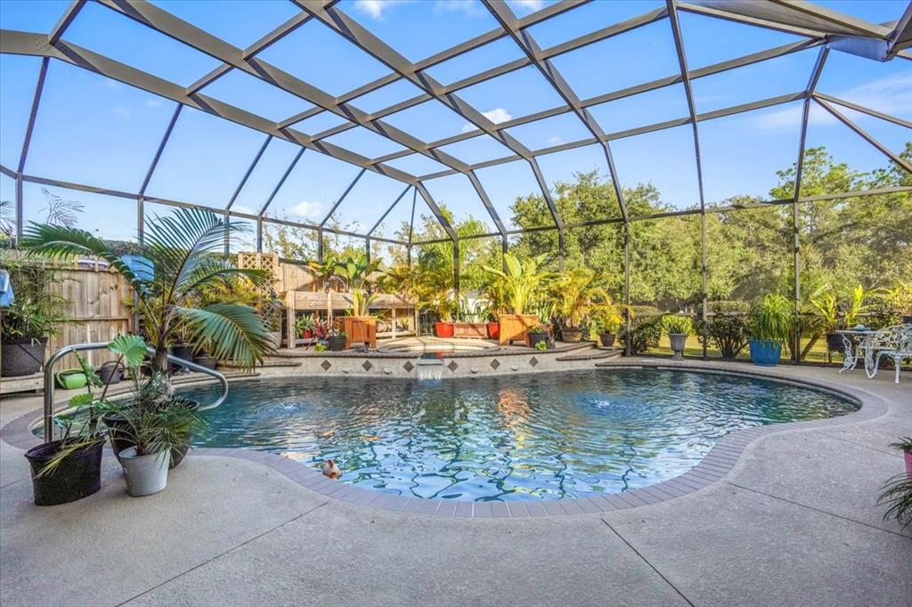 7601 226th Street East Bradenton, FL 34211 - Photo 35 of 50 a view of a swimming pool with a patio