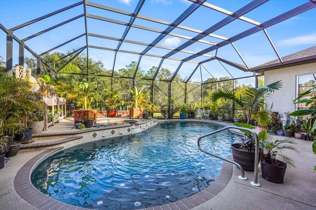 7601 226th Street East Bradenton, FL 34211 - Photo 36 of 50 a view of a swimming pool with a patio