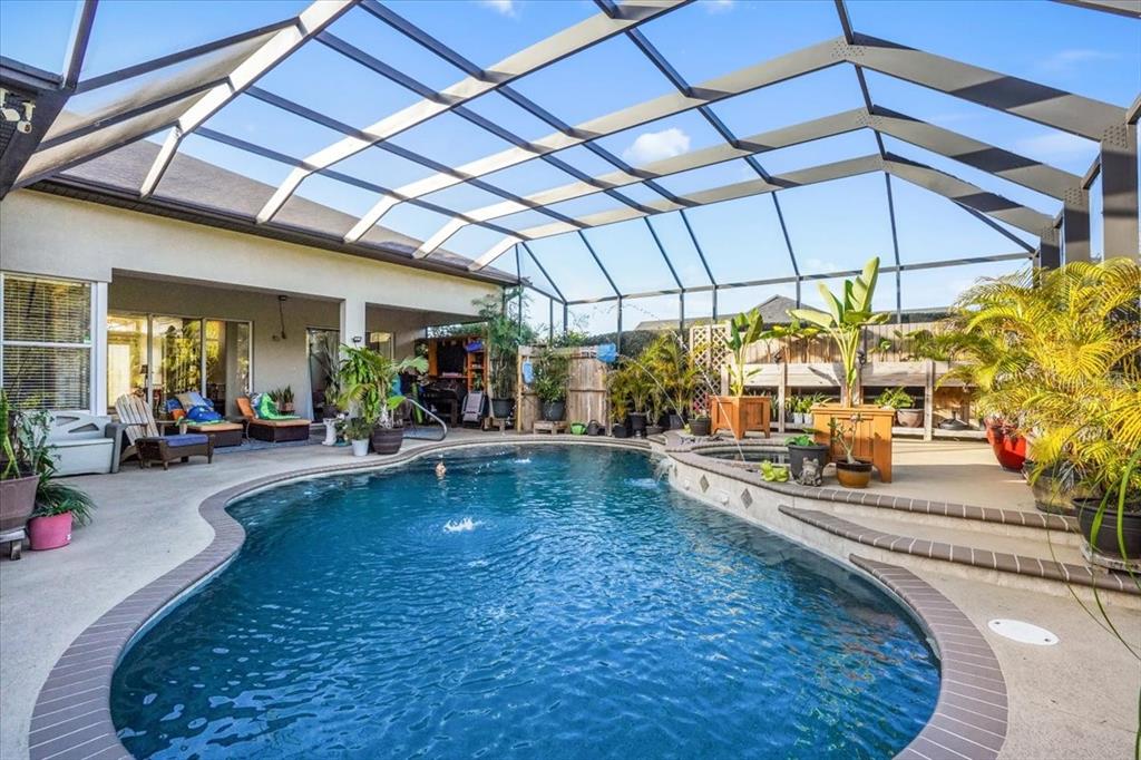 7601 226th Street East Bradenton, FL 34211 - Photo 37 of 50 a view of a swimming pool with a patio