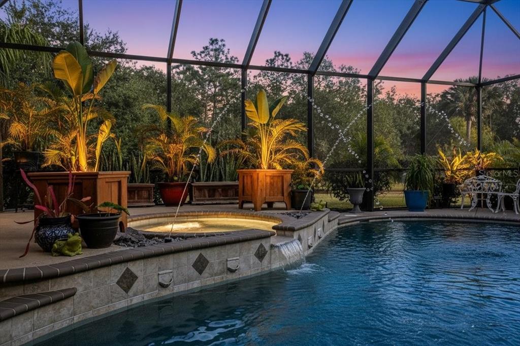 7601 226th Street East Bradenton, FL 34211 - Photo 39 of 50 a view of a swimming pool with a patio