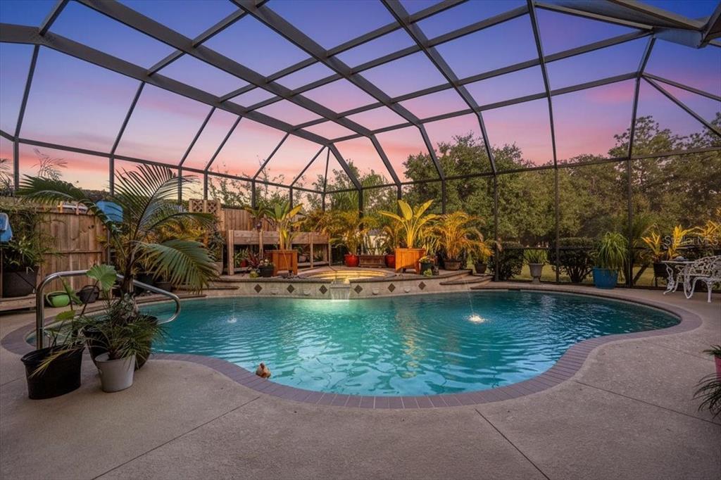 7601 226th Street East Bradenton, FL 34211 - Photo 41 of 50 a view of a swimming pool with a patio