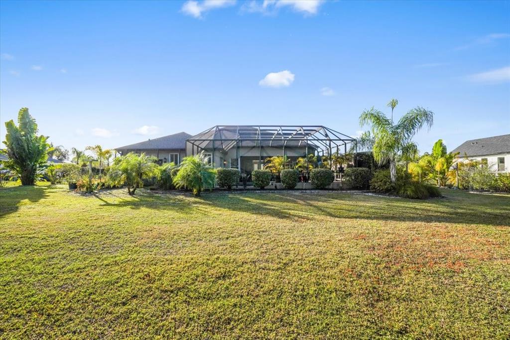 7601 226th Street East Bradenton, FL 34211 - Photo 45 of 50 a view of a swimming pool with an outdoor space and seating area