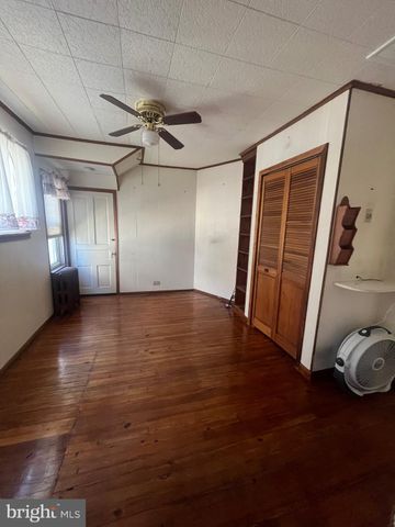 a view of a livingroom with wooden floor