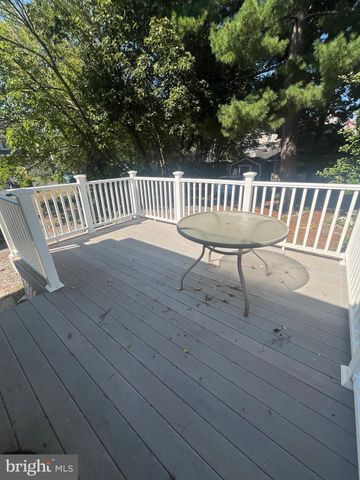 a view of a wooden chairs and bench
