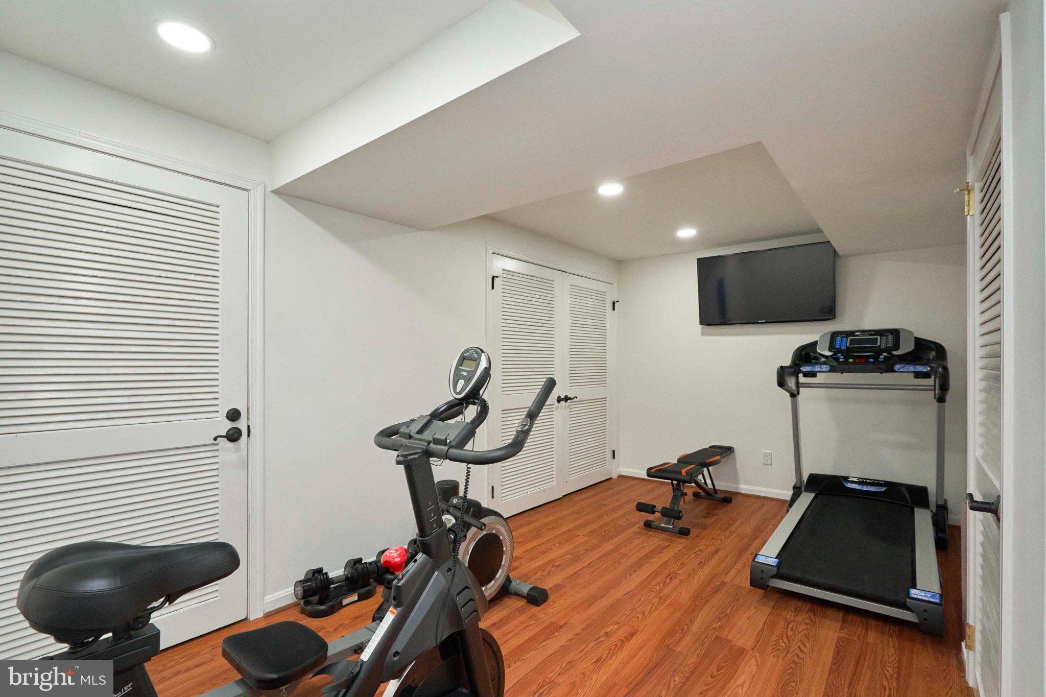 3270 Fox Mill Road Oakton, VA 22124 - Photo 29 of 66 Modern home gym with sleek equipment.