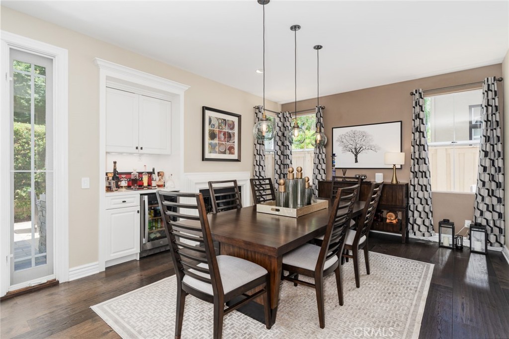 12931 MacKenzie Drive Tustin, CA 92782 - Photo 8 of 35 a view of a dining room with furniture and wooden floor