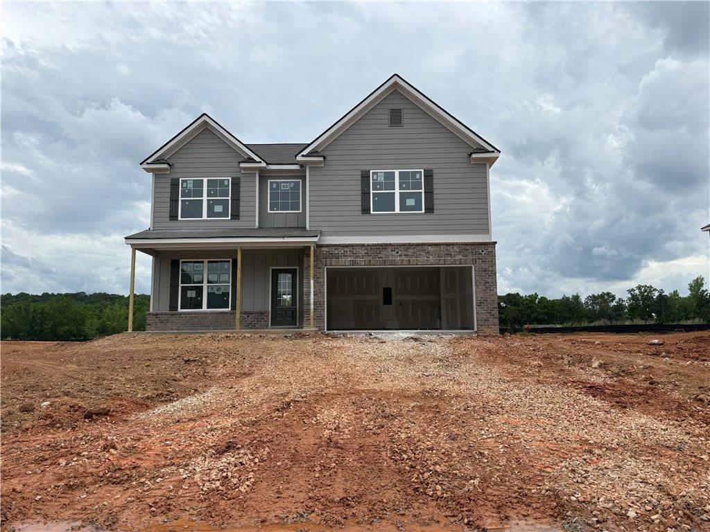 5938 Springs Way Stonecrest, GA 30038 - Photo 1 of 1 a front view of a house with yard and parking space