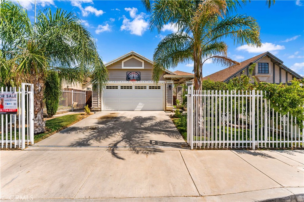 1201 East Ave R7 Palmdale, CA 93550 - Photo 1 of 1 a front view of a house with a yard