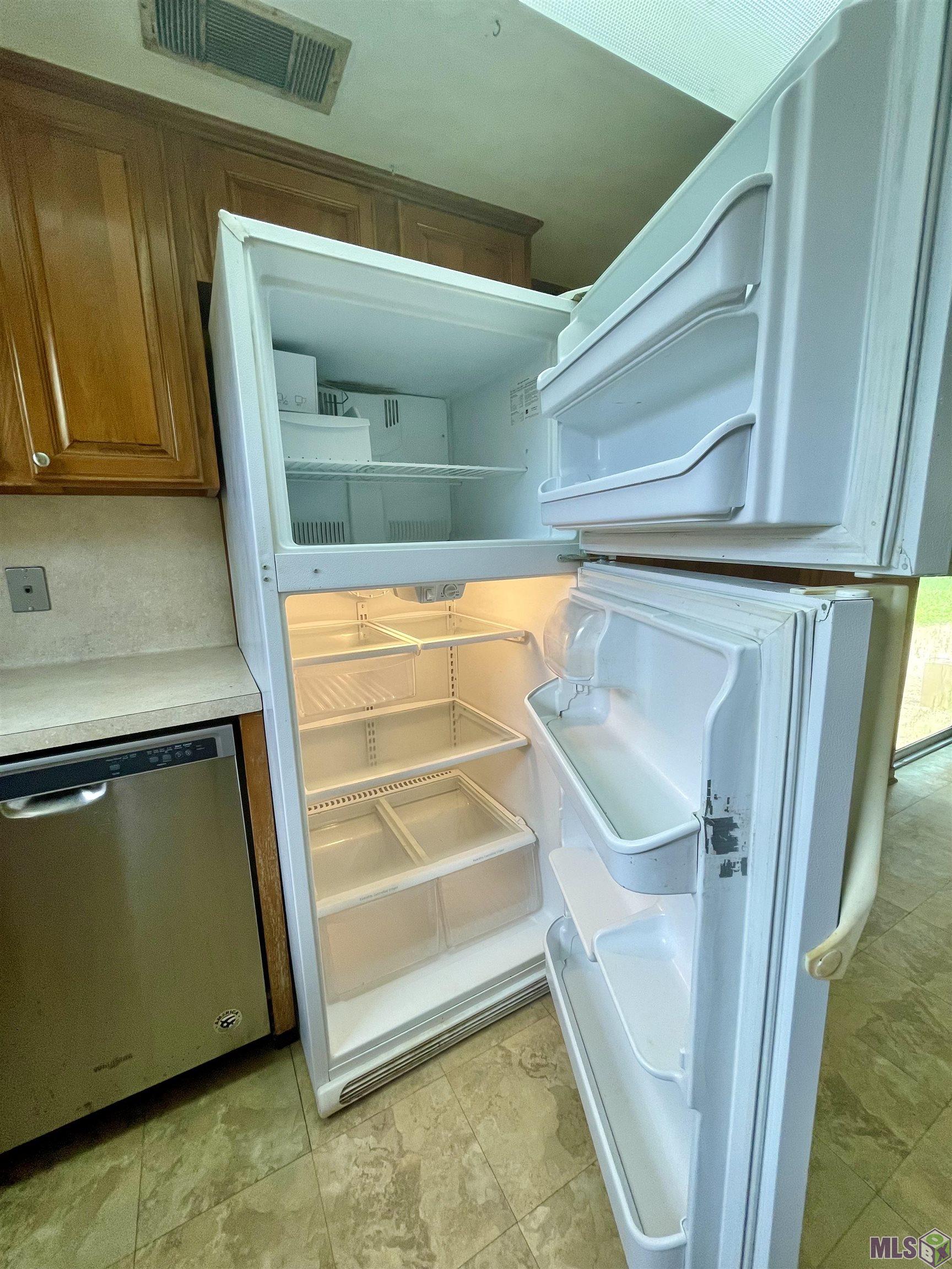 321 Huntington Drive St. George, LA 70810 - Photo 7 of 20 Whirlpool DW and Frigidaire fridge