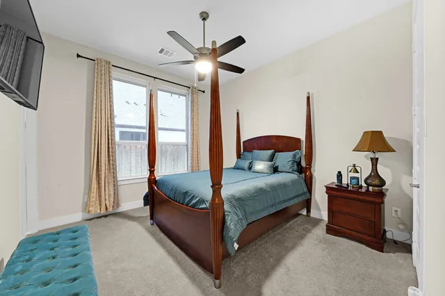 a living room with a bed furniture and a window