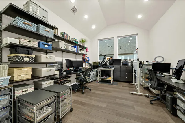 a room with gym equipment and a flat screen tv