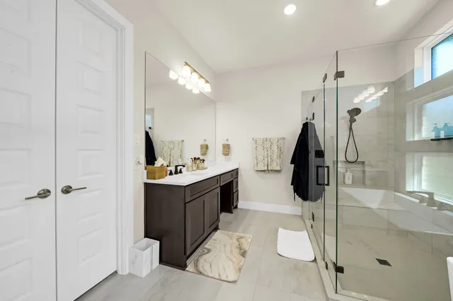 a bathroom with a sink and mirror