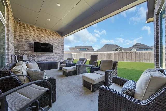 a outdoor living space with furniture and a fireplace