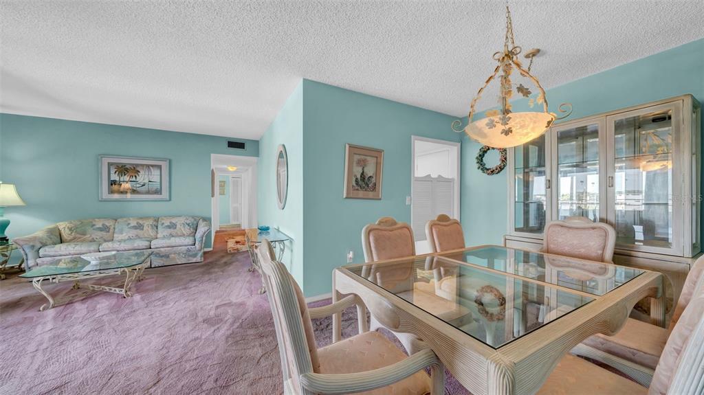 17400 Gulf Boulevard, Unit I4 North Redington Beach, FL 33708 - Photo 12 of 30 a dining room with furniture and window