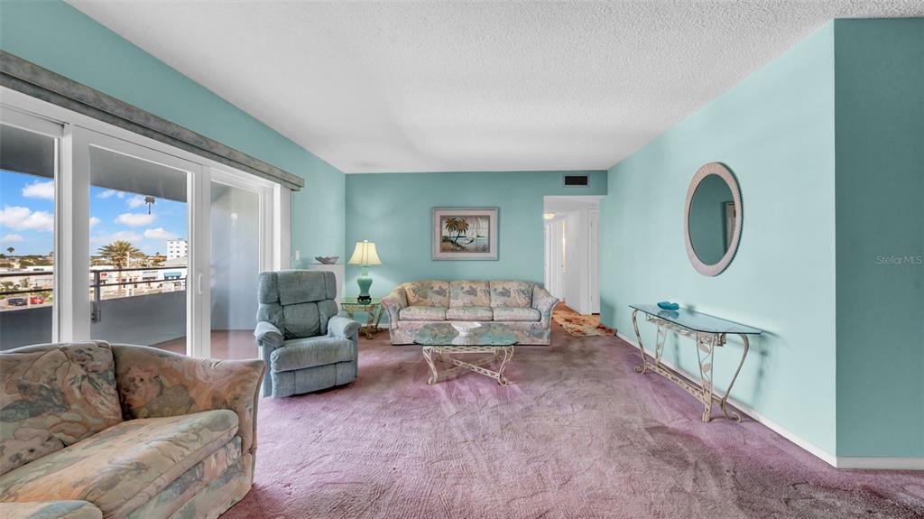 17400 Gulf Boulevard, Unit I4 North Redington Beach, FL 33708 - Photo 15 of 30 a living room with furniture and a large window